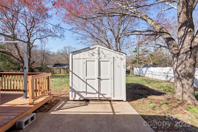 view of shed with fence