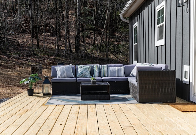 wooden terrace with an outdoor hangout area