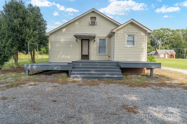 bungalow-style house featuring cooling unit