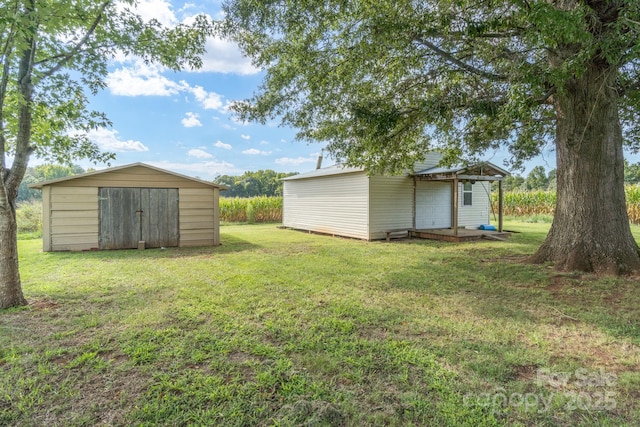 view of yard with a shed and an outdoor structure