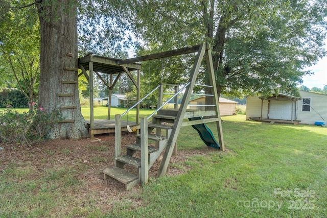 view of playground with a lawn