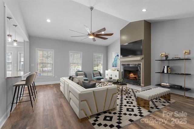 79 Mill Pond Way, Hendersonville, NC 28791 - living area with dark wood-style flooring, a fireplace, baseboards, a ceiling fan, and lofted ceiling