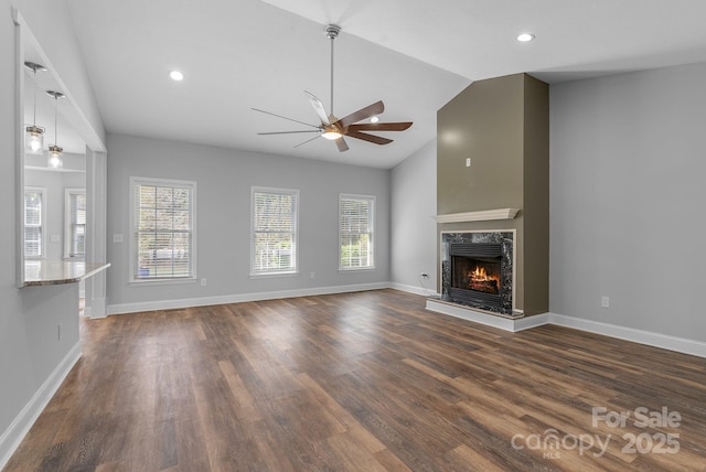 79 Mill Pond Way, Hendersonville, NC 28791 - unfurnished living room with dark wood-type flooring, a high end fireplace, vaulted ceiling, and a ceiling fan