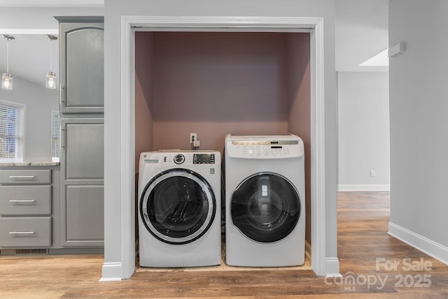 79 Mill Pond Way, Hendersonville, NC 28791 - laundry room with washing machine and dryer, baseboards, wood finished floors, and laundry area