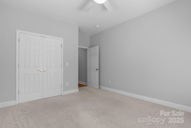 79 Mill Pond Way, Hendersonville, NC 28791 - unfurnished bedroom with baseboards, a ceiling fan, carpet flooring, and a closet