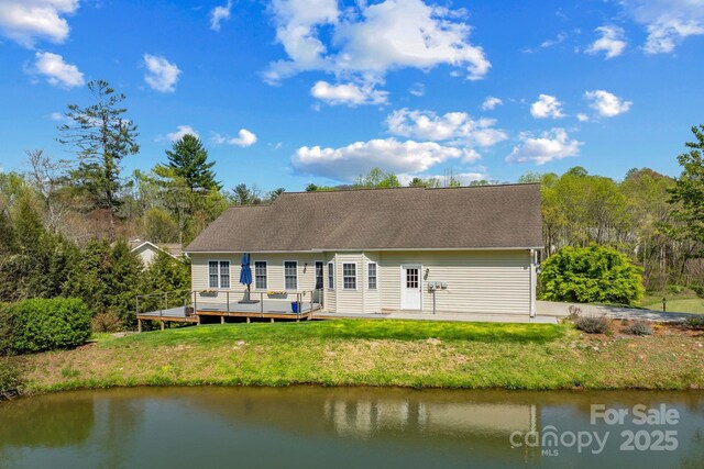79 Mill Pond Way, Hendersonville, NC 28791 - back of house with a lawn and a deck with water view