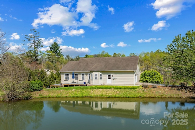 79 Mill Pond Way, Hendersonville, NC 28791 - back of house with a yard, a deck with water view, and a shingled roof