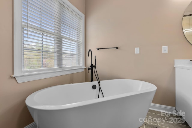 79 Mill Pond Way, Hendersonville, NC 28791 - full bathroom featuring a soaking tub, tile patterned floors, and vanity