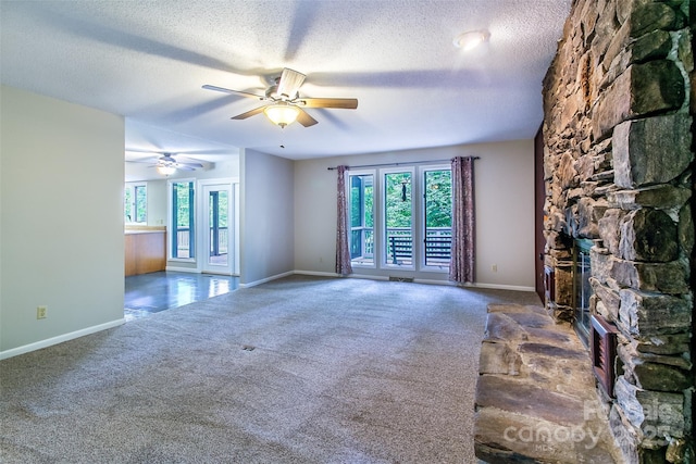 162 Southerland Rd, Pisgah Forest, NC 28768 - unfurnished living room with carpet, a textured ceiling, ceiling fan, and baseboards