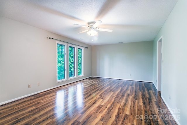 162 Southerland Rd, Pisgah Forest, NC 28768 - unfurnished room with ceiling fan, dark wood-style floors, and baseboards