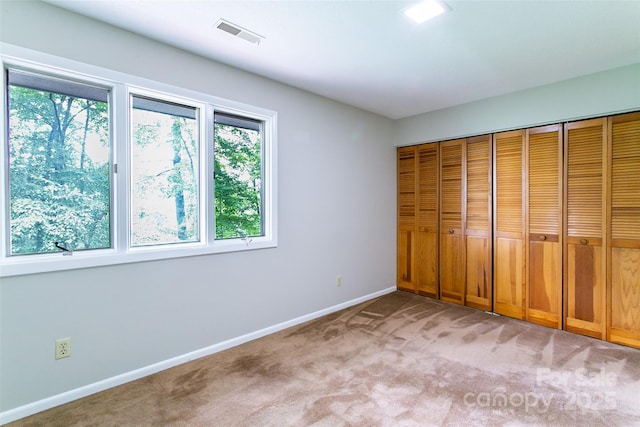 162 Southerland Rd, Pisgah Forest, NC 28768 - unfurnished bedroom featuring carpet, baseboards, and a closet