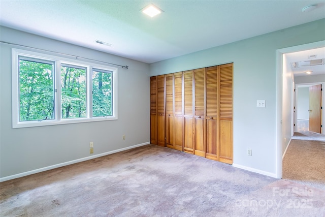 162 Southerland Rd, Pisgah Forest, NC 28768 - unfurnished bedroom with carpet flooring, baseboards, and a closet