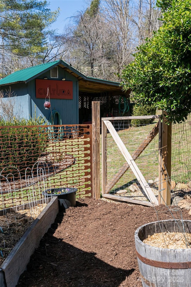 view of outbuilding featuring fence