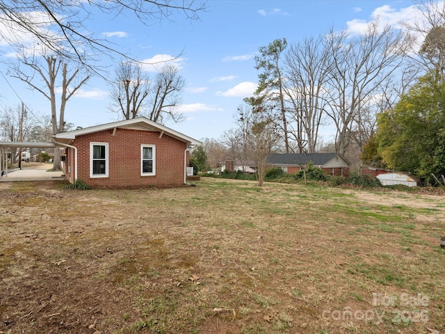 view of yard featuring a carport