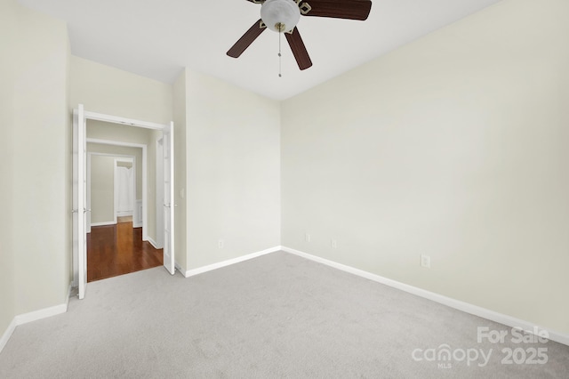 unfurnished bedroom featuring baseboards, carpet, and ceiling fan