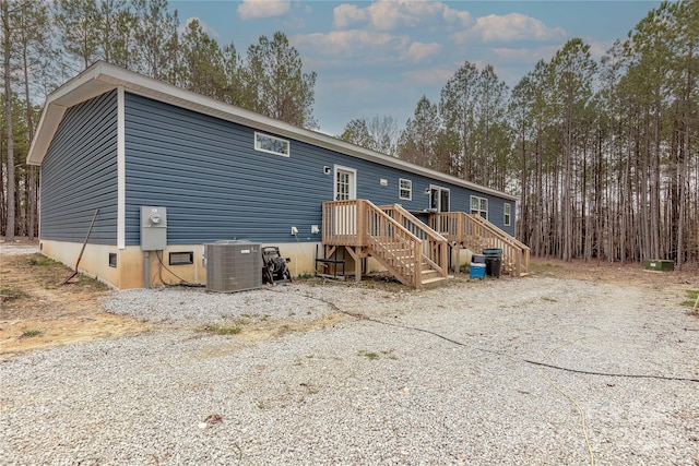 back of property featuring central air condition unit