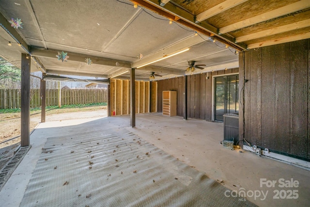 view of patio / terrace with fence and a ceiling fan