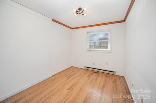 empty room with ornamental molding, a baseboard radiator, wood finished floors, and baseboards