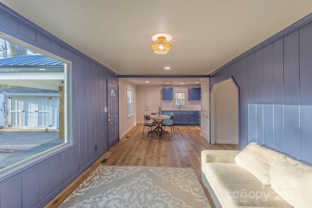 interior space featuring crown molding and light wood-style flooring