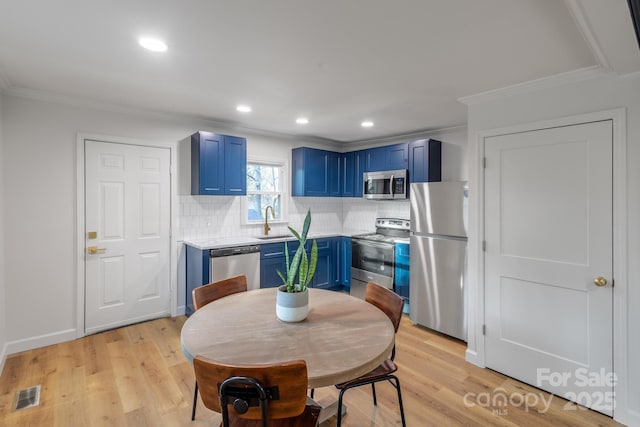 dining area with recessed lighting, visible vents, crown molding, and light wood-style flooring