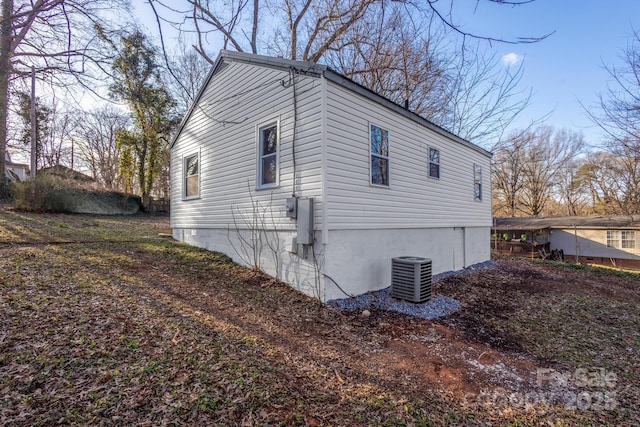 view of property exterior featuring central AC