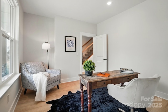 office space with recessed lighting, baseboards, and light wood finished floors