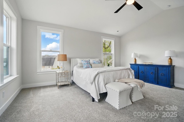 carpeted bedroom with baseboards, ceiling fan, and lofted ceiling