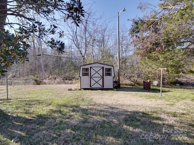 view of yard featuring an outbuilding and a shed