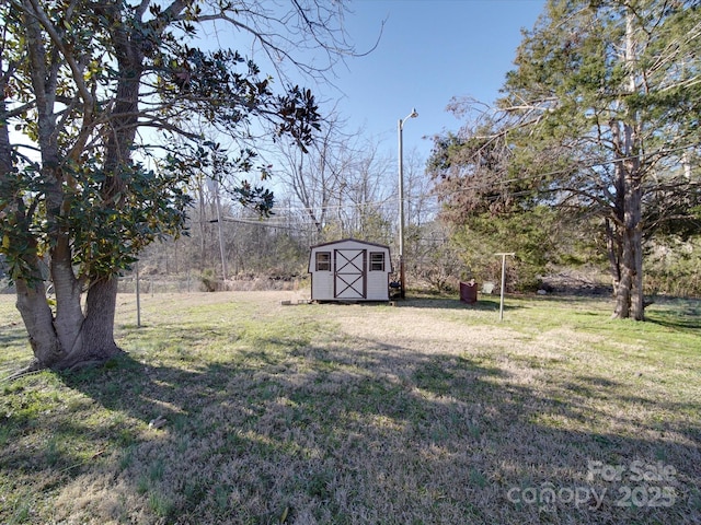 view of yard with an outbuilding and a storage shed