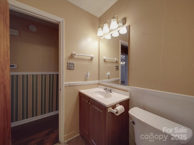 bathroom with vanity and toilet