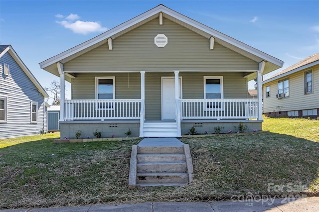 bungalow-style house with a porch and a front yard