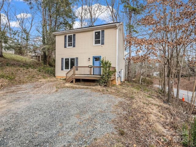 view of front of home with a wooden deck