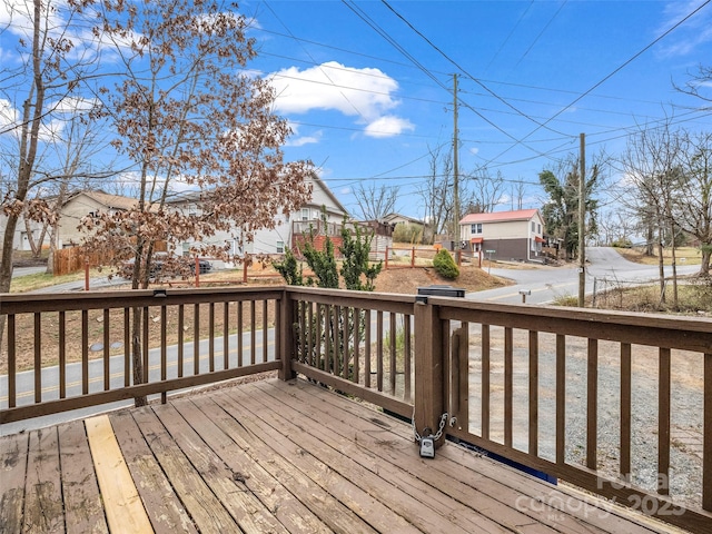 wooden deck featuring a residential view