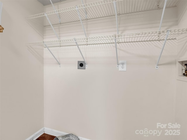 washroom featuring laundry area, washer hookup, electric dryer hookup, and baseboards