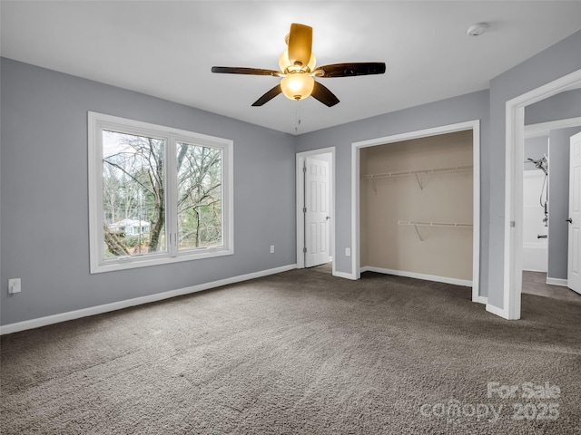 unfurnished bedroom with a closet, carpet flooring, and baseboards