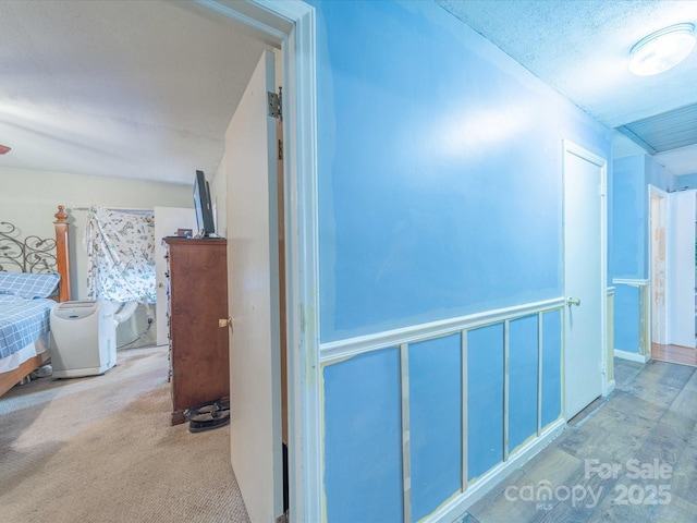 hallway with carpet flooring