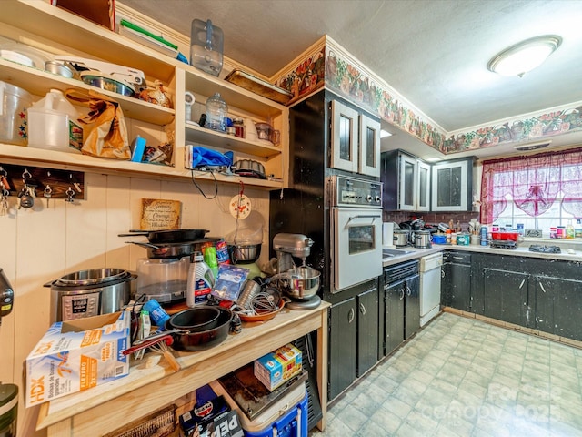 kitchen with open shelves, white appliances, light countertops, and light floors