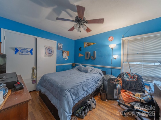 bedroom featuring a closet, a ceiling fan, and hardwood / wood-style floors