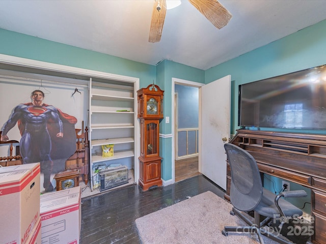 office space featuring a ceiling fan, baseboards, and hardwood / wood-style floors