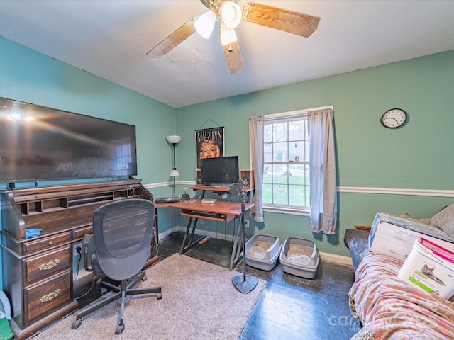 office with ceiling fan and baseboards