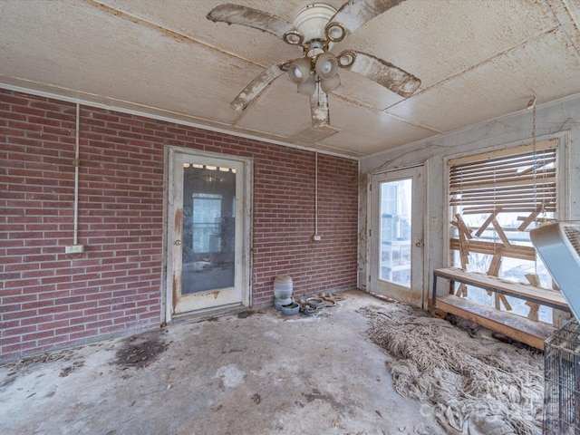 interior space featuring brick wall