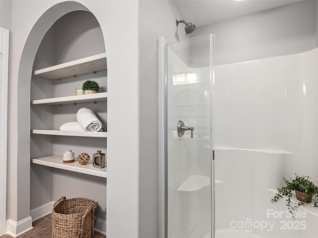 bathroom featuring a shower stall