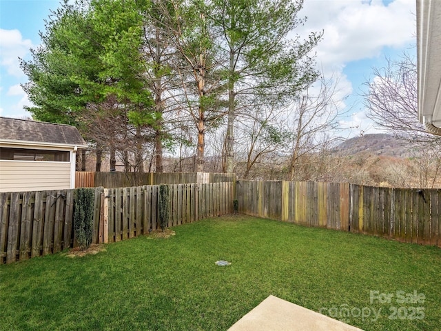 view of yard with a fenced backyard