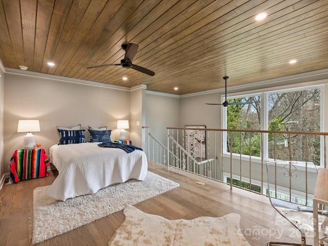 bedroom with recessed lighting, wood finished floors, wooden ceiling, and crown molding