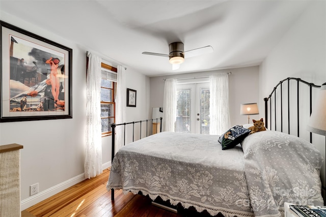 bedroom with baseboards, a ceiling fan, hardwood / wood-style flooring, access to exterior, and french doors