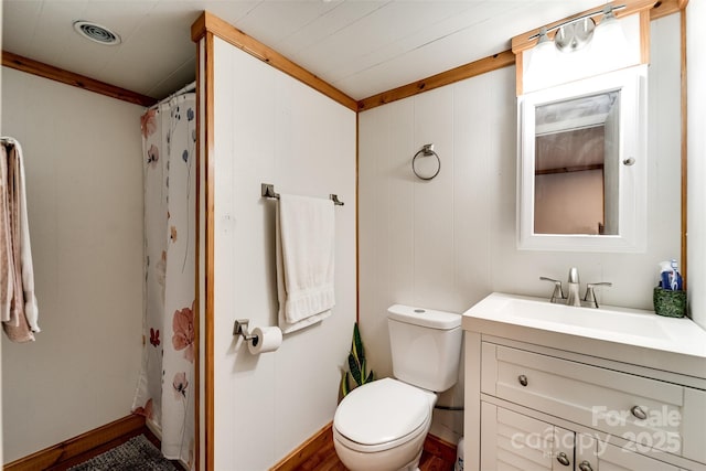 bathroom with toilet, curtained shower, vanity, and visible vents