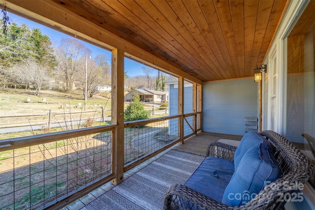 sunroom featuring wood ceiling