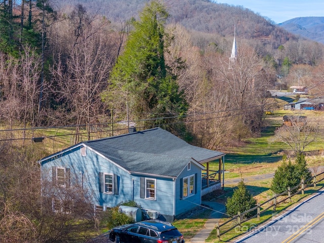 bird's eye view with a mountain view and a view of trees