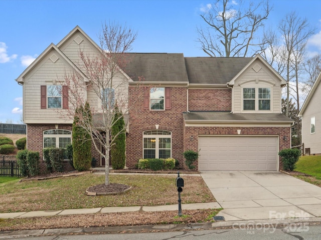 view of front of property with a garage, concrete driveway, brick siding, and a front lawn