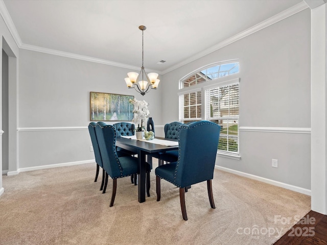 dining area with carpet, baseboards, and an inviting chandelier